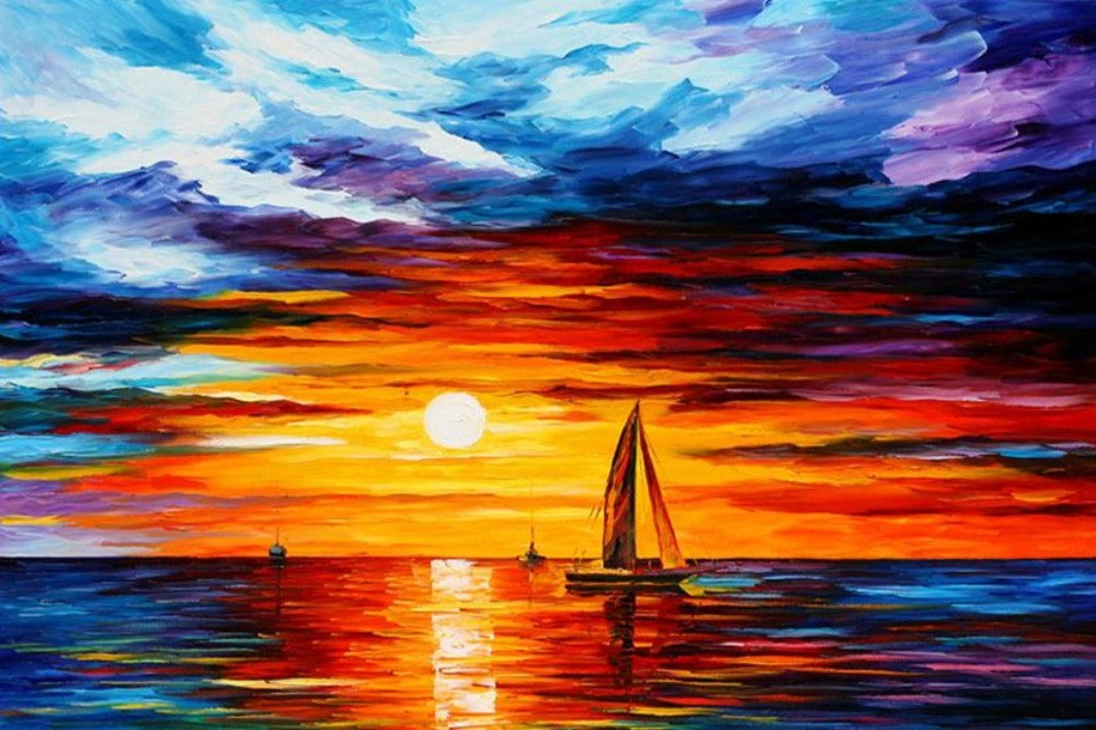 Sailboat in the middle of the sea under a sunset